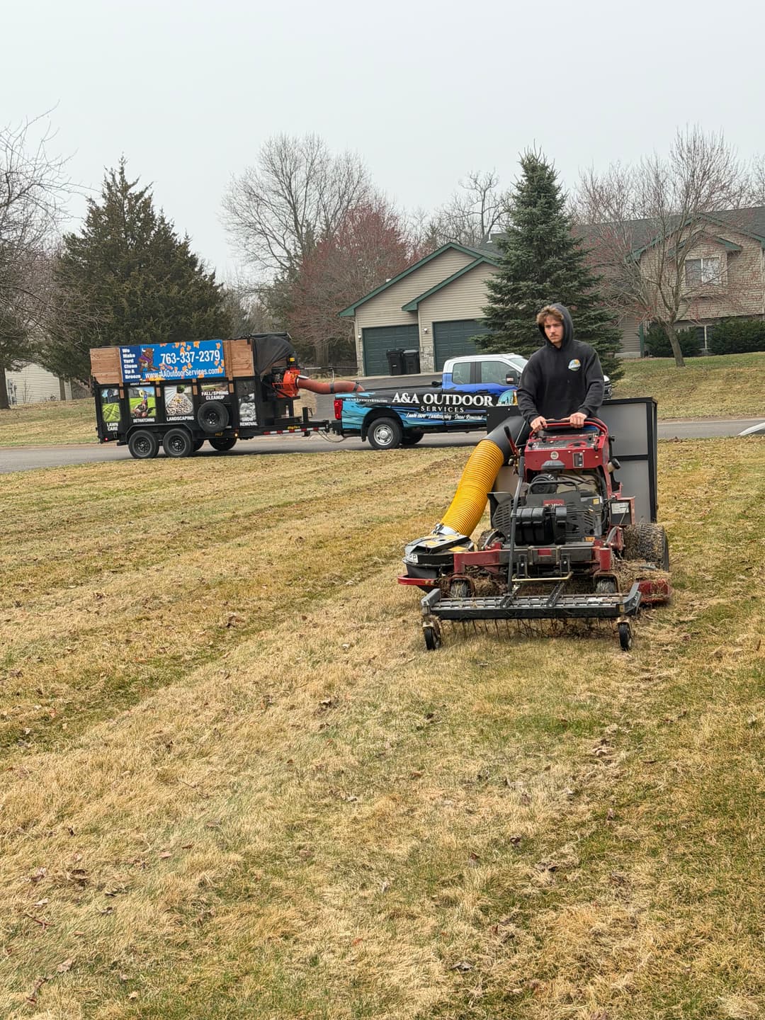 Lawn care service using equipment for grass maintenance in a residential area.