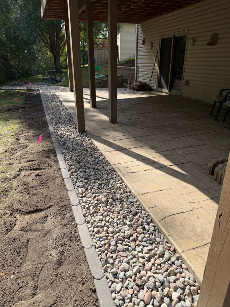 Gallery photos for Enhancing Patio Edges with Bullet Pavers and Decorative Rock: Image #1